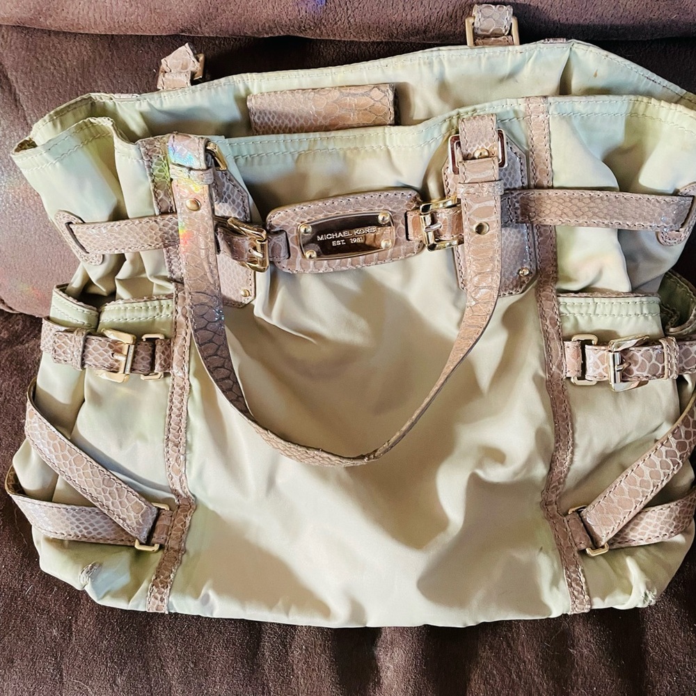 Beige Michael Kors purse looks brand new.